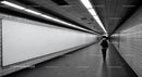 Underground Subway Tunnel with Fluorescent Lighting and Tiled Walls