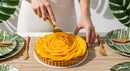 Mango Fruit Tart with Peach Slice Decoration on Elegant Dessert Plate