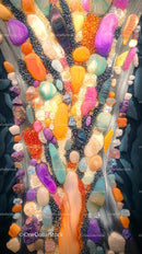 Colorful Collection of Polished and Raw Gemstones Displayed