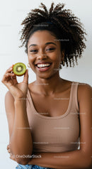 Joyful Woman Holding Kiwi with Bright Smile in Casual Outfit