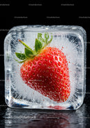 Fresh strawberry frozen inside a clear ice cube