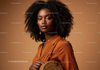 Elegant African Woman in Brown Satin Shirt with Curly Hair