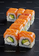 Fresh salmon sushi rolls with avocado and cream cheese