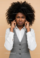Frustrated Woman Covering Ears with Annoyed Expression