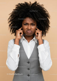 Frustrated Woman Covering Ears with Annoyed Expression
