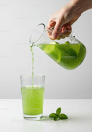 Refreshing Green Citrus Drink Being Poured Into Glass