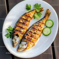 Grilled Mackerel with Cucumber Slices and Parsley on White Plate