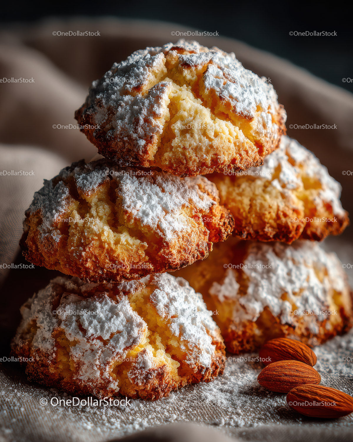 Golden Cream Puffs with Powdered Sugar and Almond Garnish for Dessert