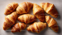 Fresh Golden Croissants on a Light Surface Perfect for Bakery and Breakfast