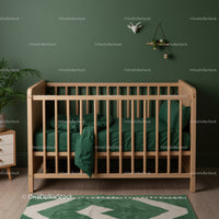 Natural Wooden Baby Crib in Green Nursery with Cozy Bedding
