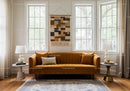 Cozy living room with mustard velvet sofa and natural light