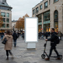 Busy urban street with blank advertising display board