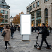 Busy urban street with blank advertising display board