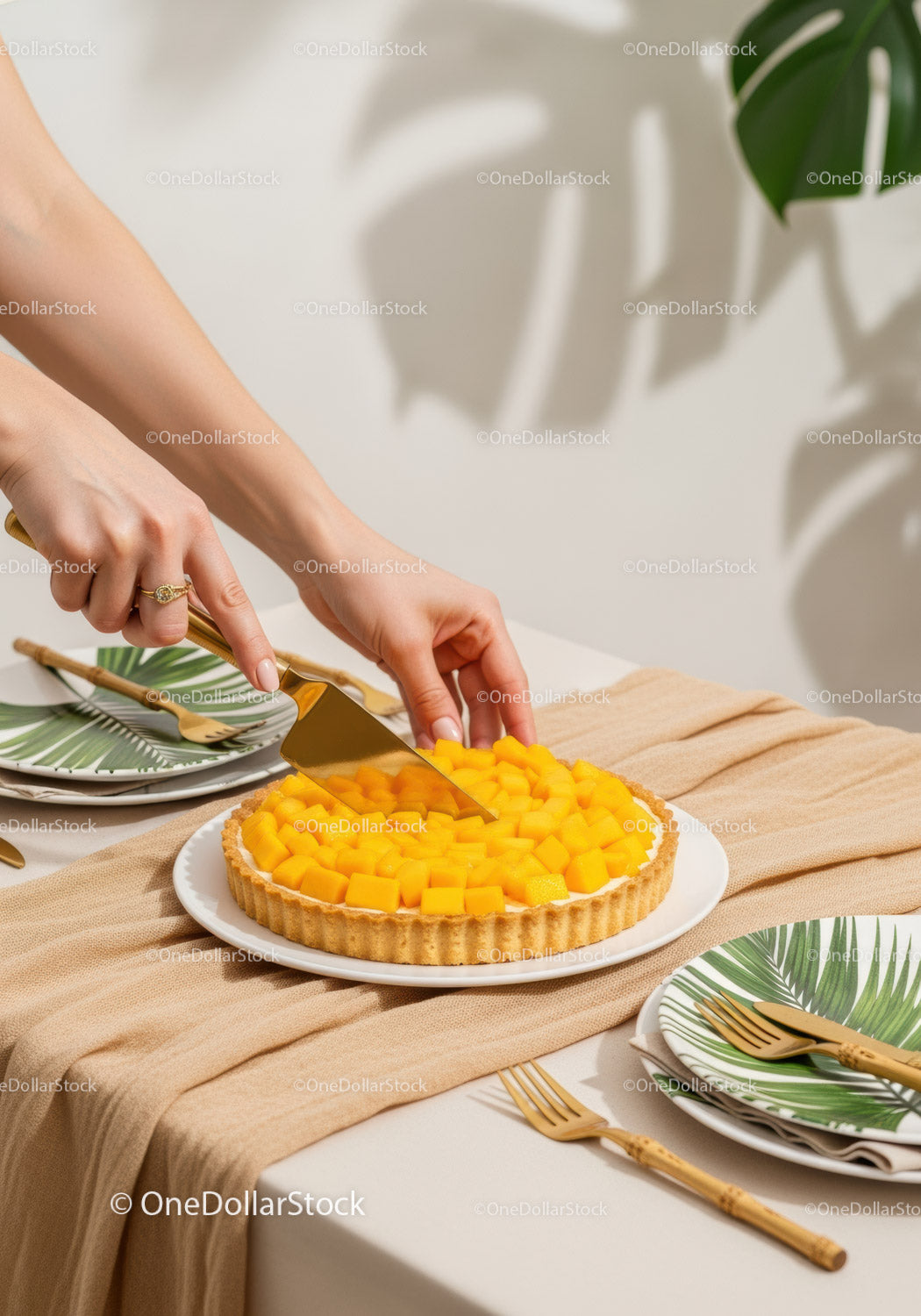 Mango Tart with Fresh Fruit Slices on Elegant Table Setting