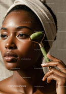 Close Up of African Woman with Jade Roller on Cheek for Skin Care
