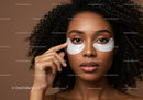 Woman with Curly Hair and Eye Patches for Skincare Treatment