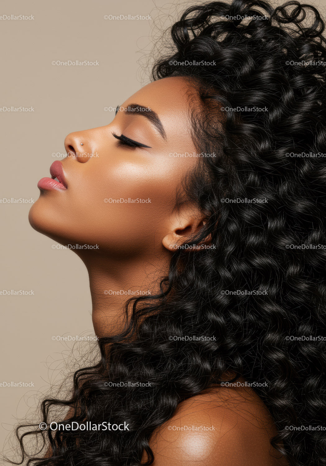 Profile of calm woman with voluminous curly hair