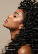 Profile of calm woman with voluminous curly hair