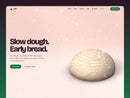 Lark bakery template hero on rosy pink: a round loaf of dough marked with flour rings from a proofing basket on a floured counter, the headline Slow dough. Early bread. and a green Order bread button